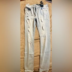 NWT Women’s Express light wash super distressed mid rise legging skinny Jean 6